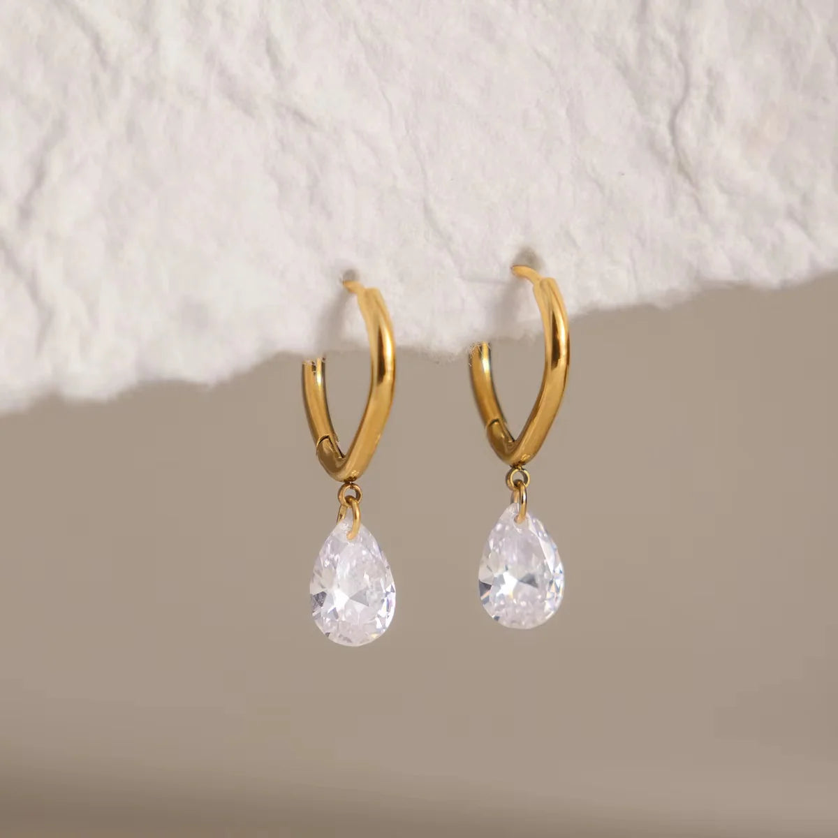 Lucy gold mini hoop earrings with pear crystal drop, view 9