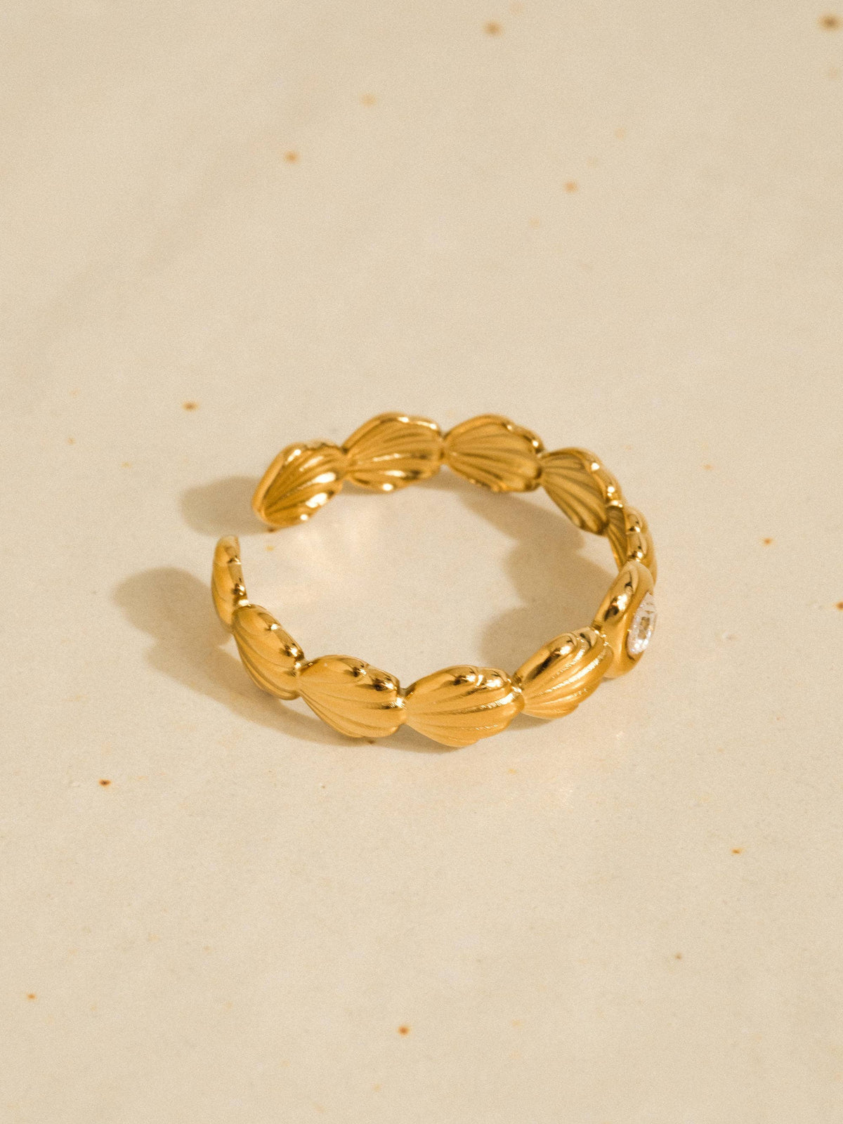 Marina gold scallop shell band ring with a centre stone, view 4