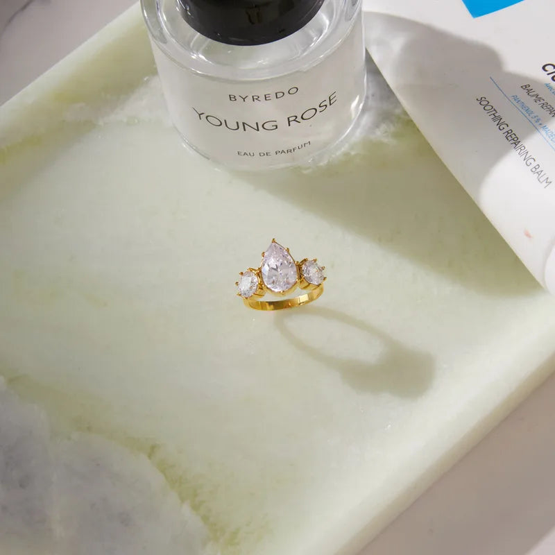 Rhea gold ring with a pear stone and two round stones, view 4