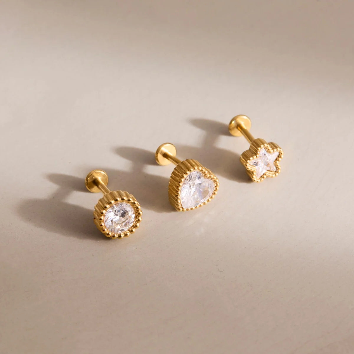Millie gold stud earring set with heart, round and star crystals in beaded bezels, view 5