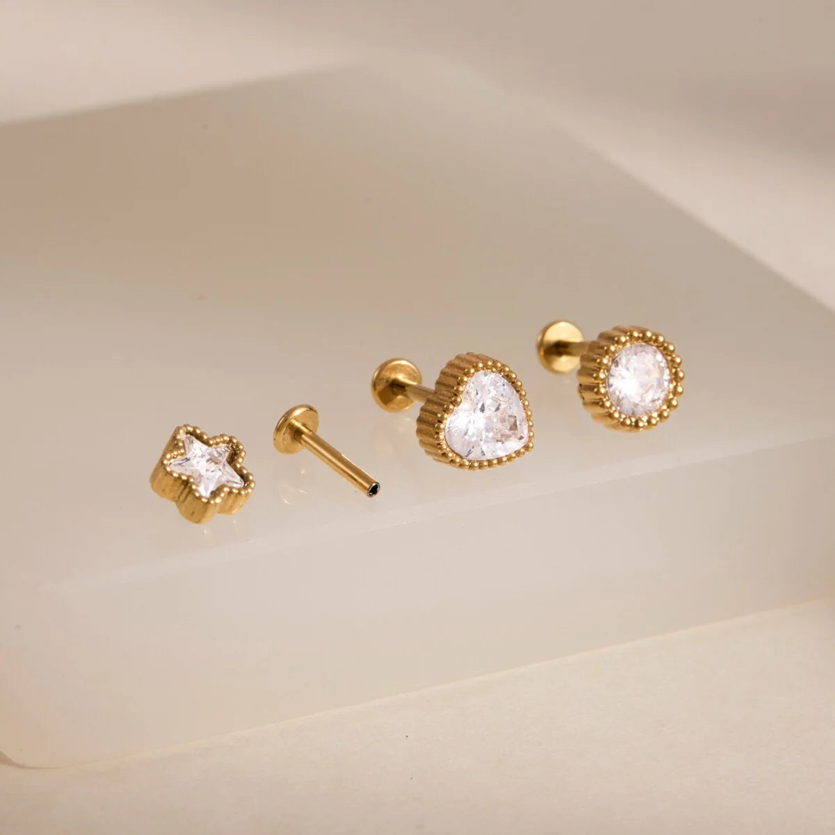 Millie gold stud earring set with heart, round and star crystals in beaded bezels, view 7