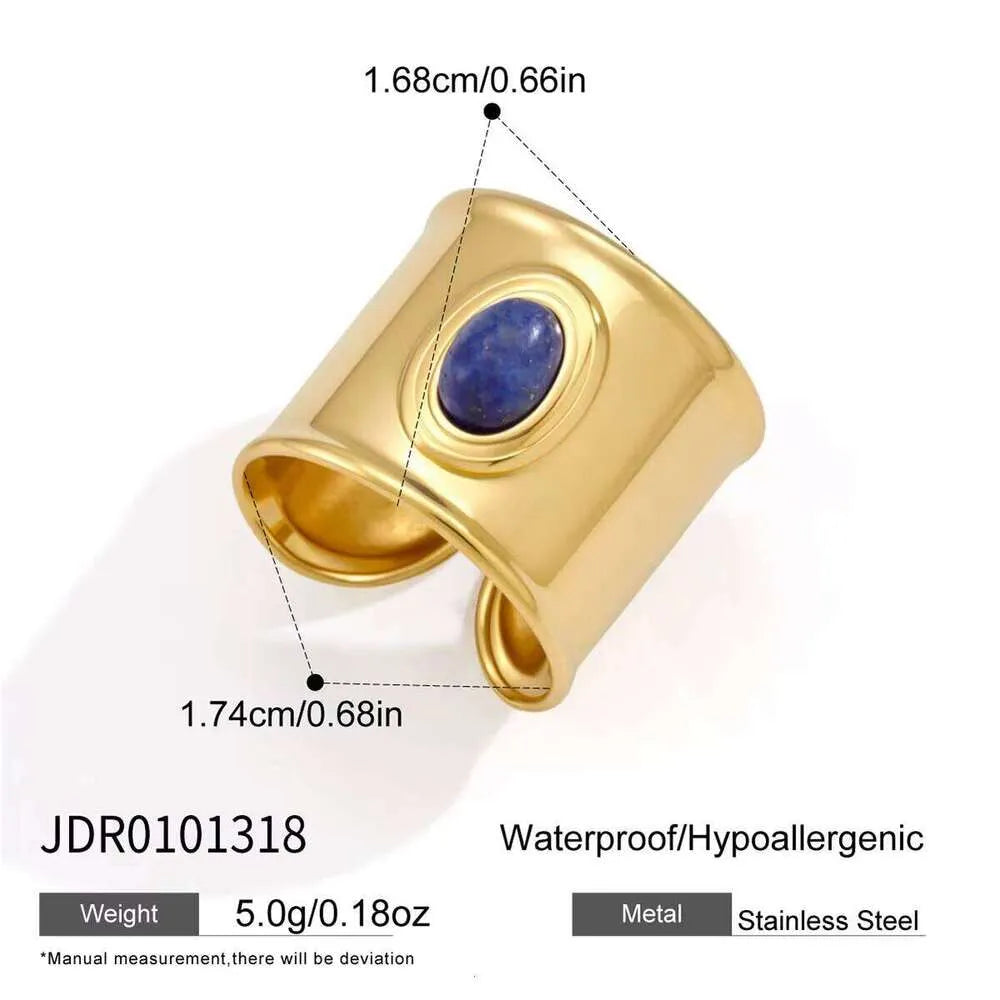 Naomi wide gold band ring with a blue oval stone, view 2