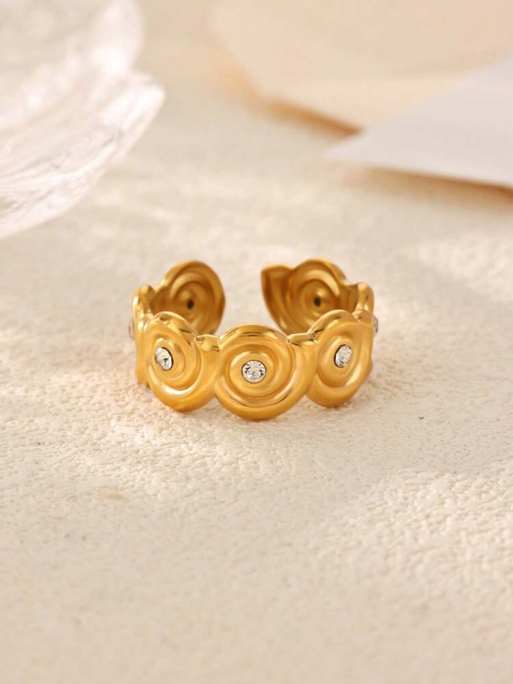 Rosalie gold wavy swirl band ring with small clear stones