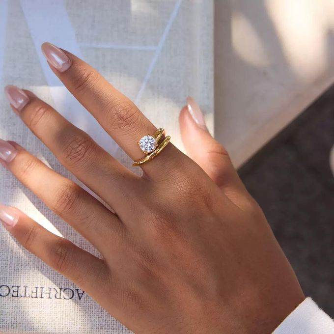 Isla gold double wave band ring with a round solitaire stone, view 2