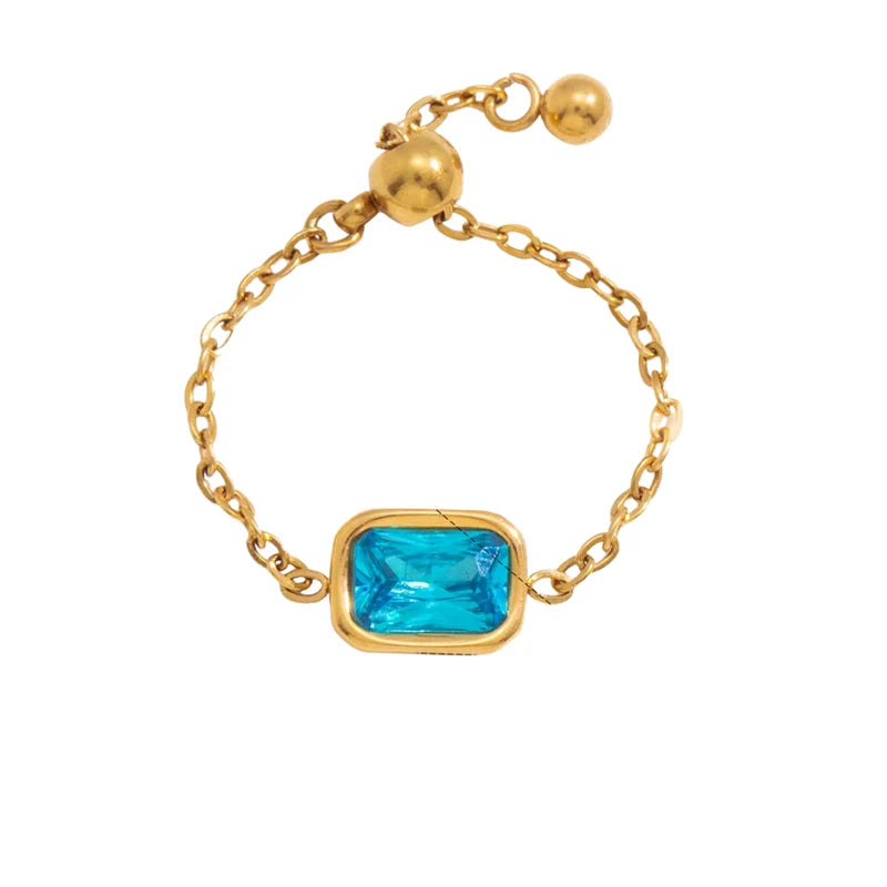 Lorelei gold chain ring with a blue rectangle stone
