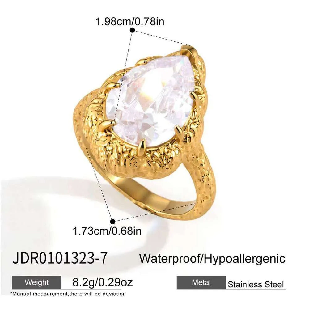Clarissa textured gold statement ring with a large pear stone