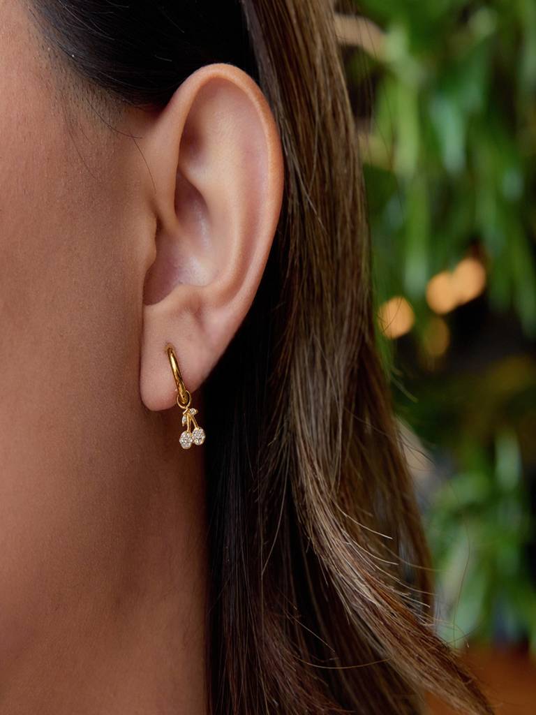 Posy gold huggie earrings with crystal cherry charm, view 2
