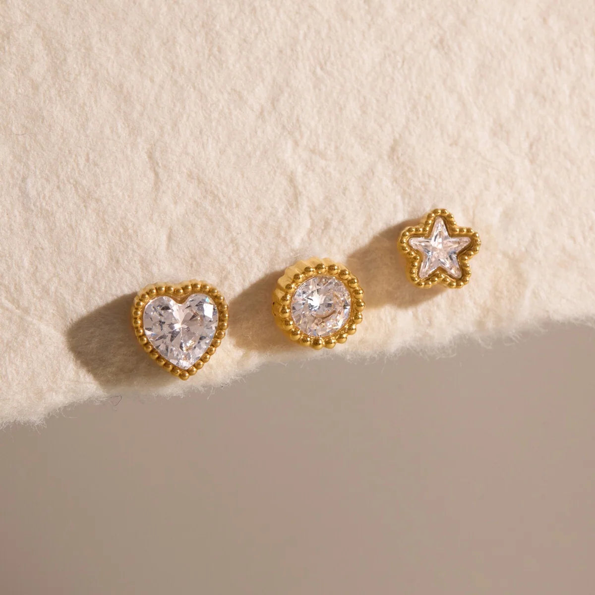 Millie gold stud earring set with heart, round and star crystals in beaded bezels, view 6