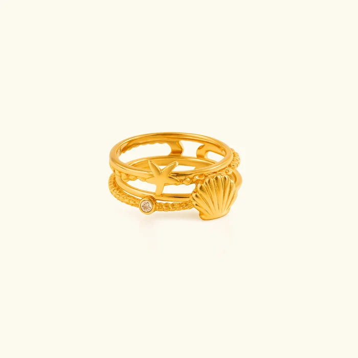 Sirena gold stacked triple band ring with a shell
