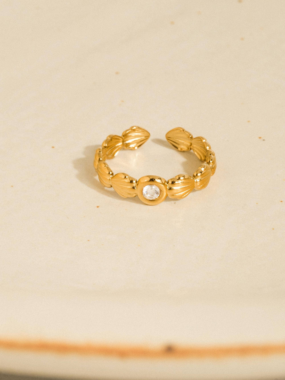 Marina gold scallop shell band ring with a centre stone, view 3
