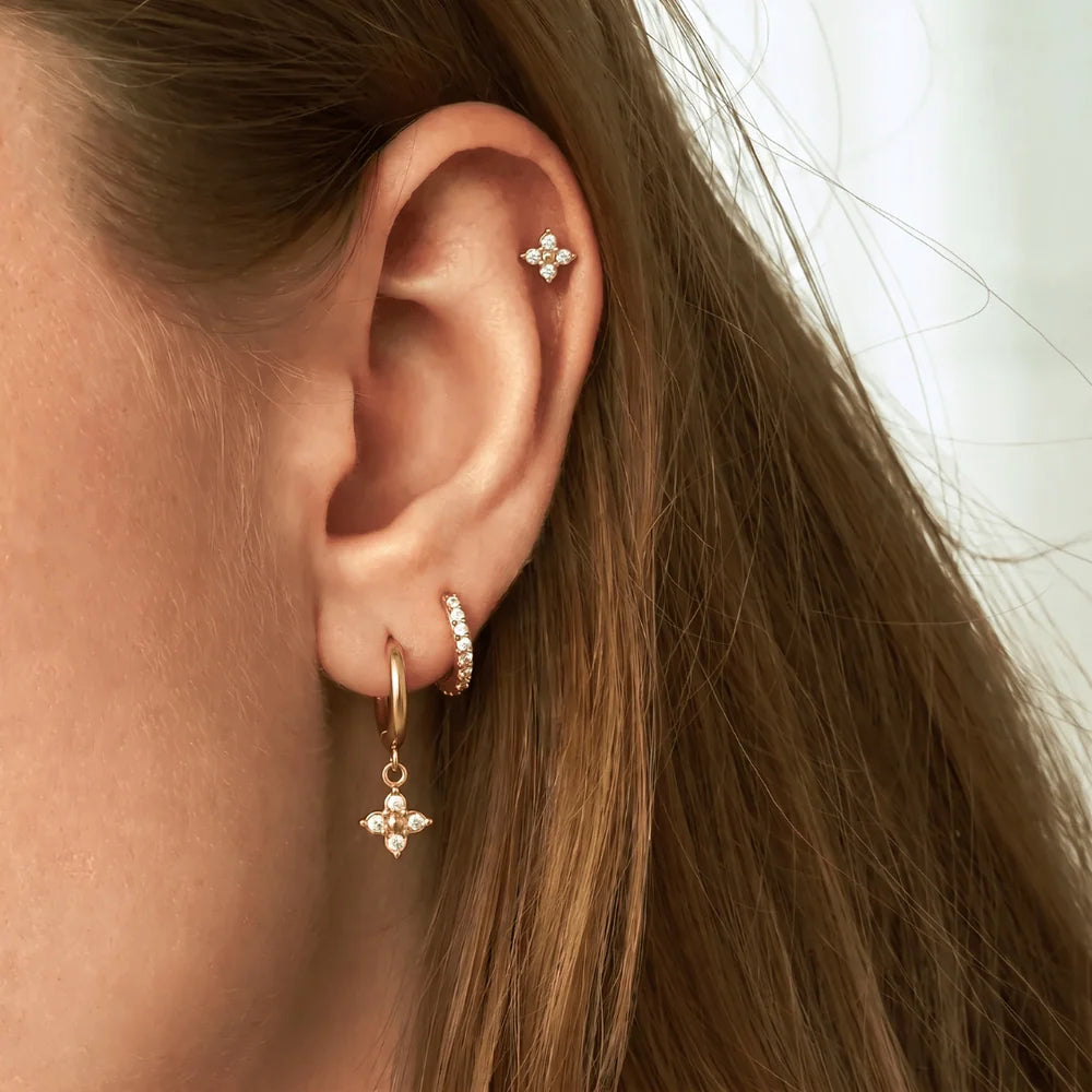 Eliza three piece gold earring set with crystal flower drop hoop, pave huggie and flower stud, view 2