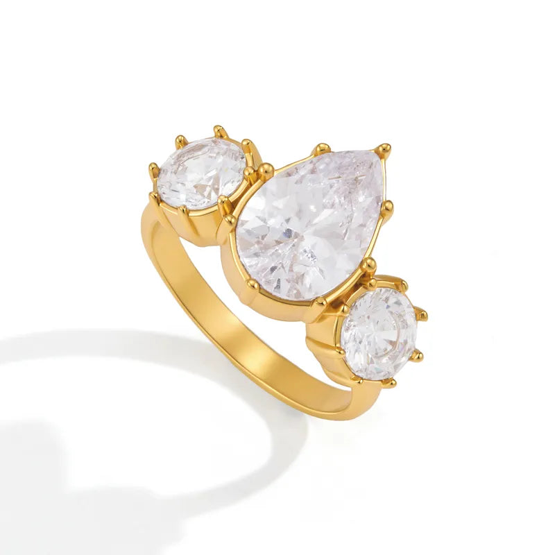 Rhea gold ring with a pear stone and two round stones