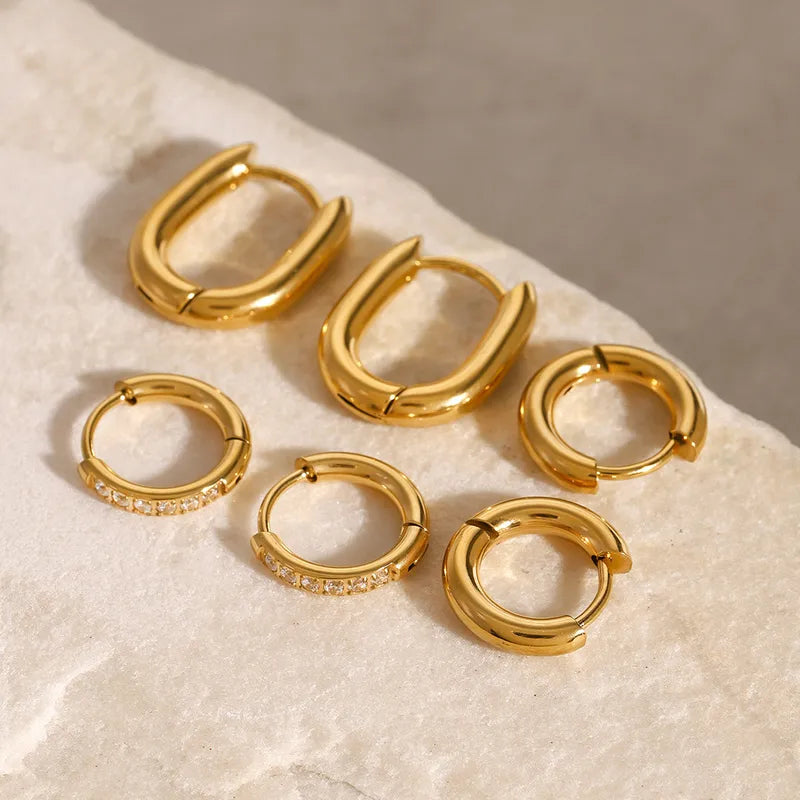 Jemima five pair gold hoop earring set with oval hoops and pave huggies