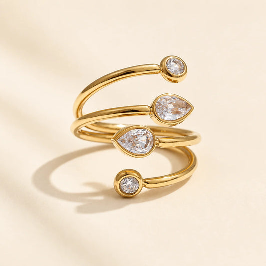 Aria gold spiral ring with three clear stones