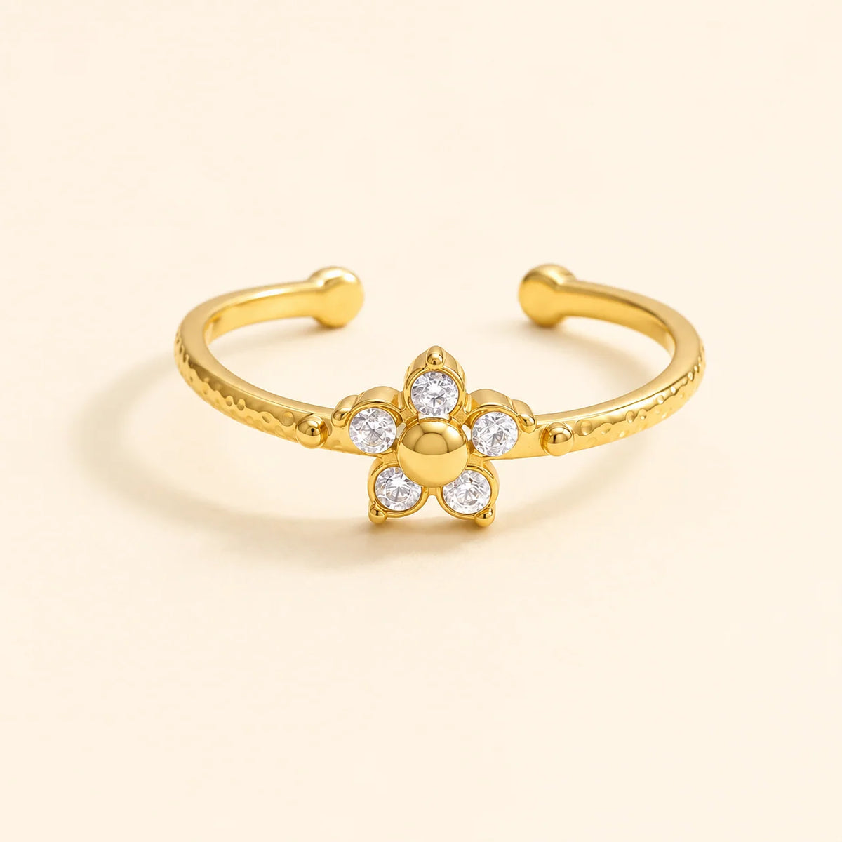Camellia dainty gold open ring with a single flower of clear stones