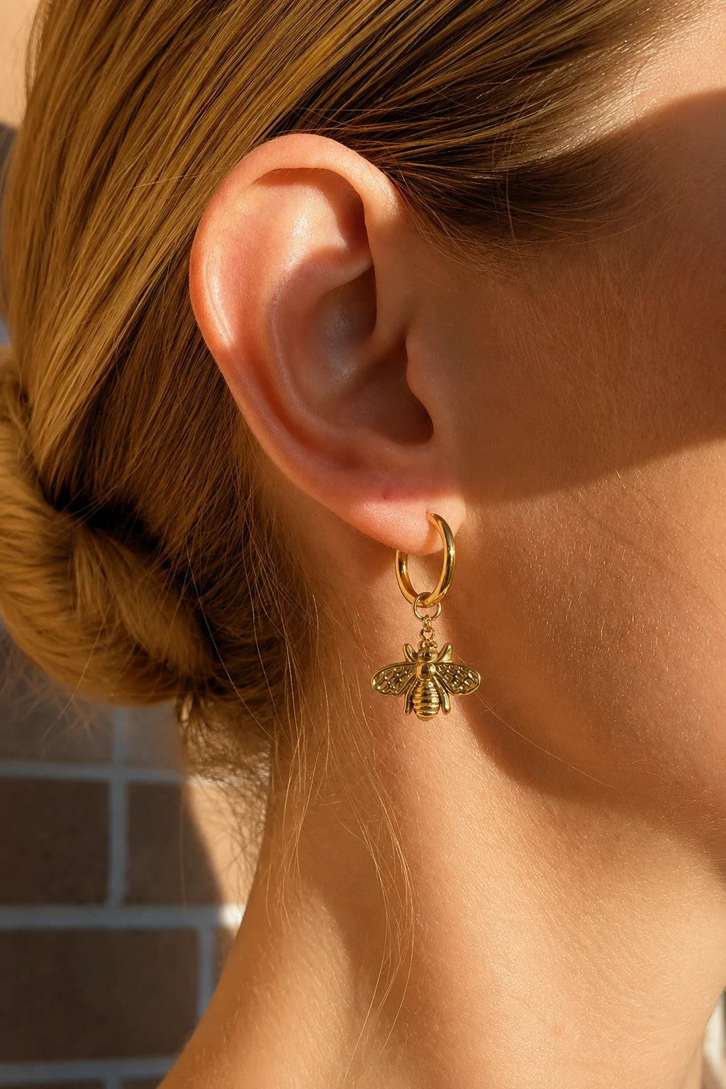 Sage gold huggie earrings with bee charm, view 4