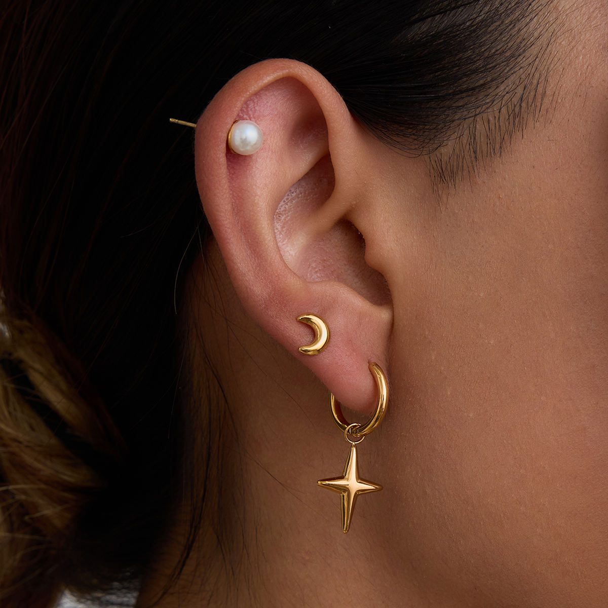 Maribel gold earring set with star charm hoops, pearl studs and moon studs, view 3