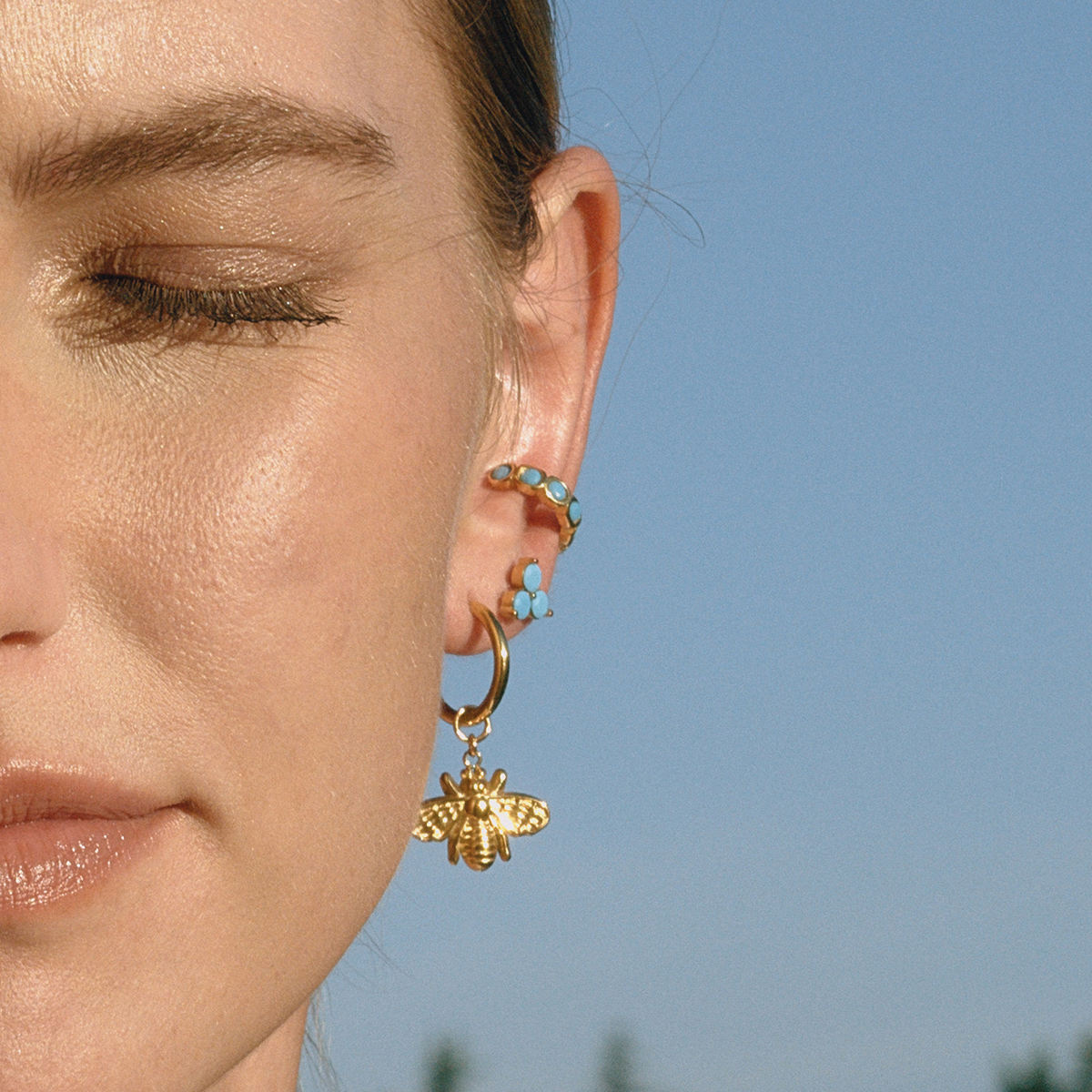 Sage gold huggie earrings with bee charm, view 3