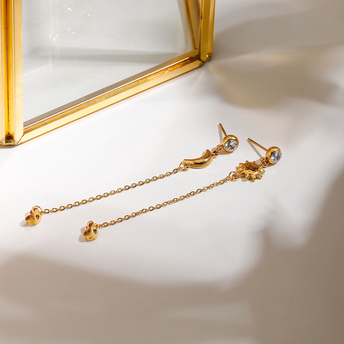 Lorna gold crystal stud earrings with moon and sun chain drops, view 5