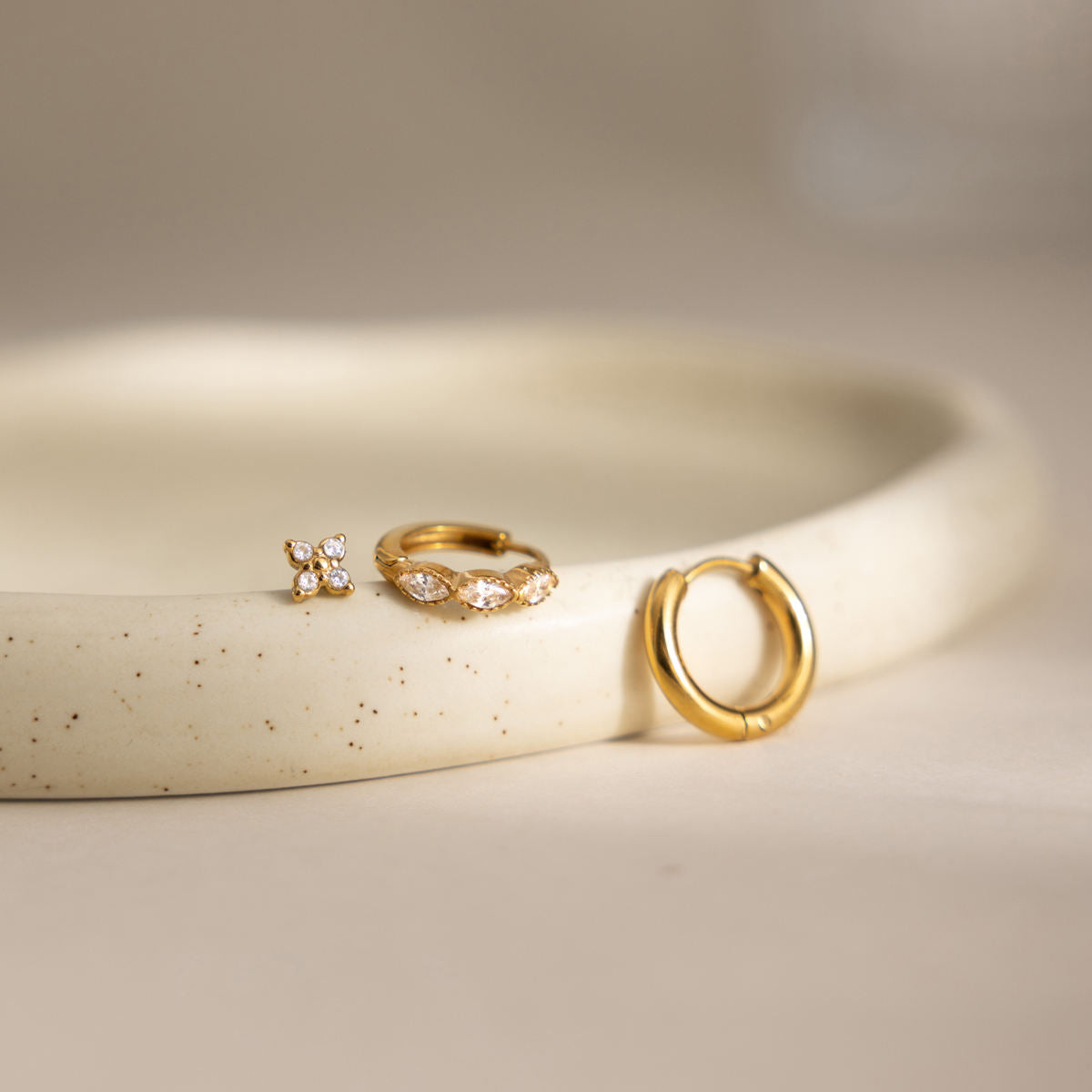 Cecily three piece gold earring set with plain hoop, clear marquise huggie and crystal flower stud, view 4