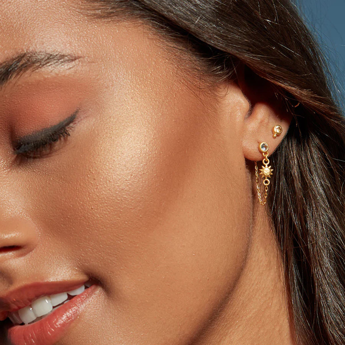Lorna gold crystal stud earrings with moon and sun chain drops, view 4