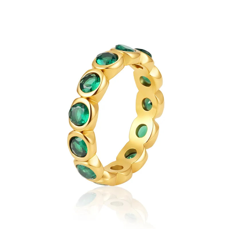 Fern gold eternity band with round green stones