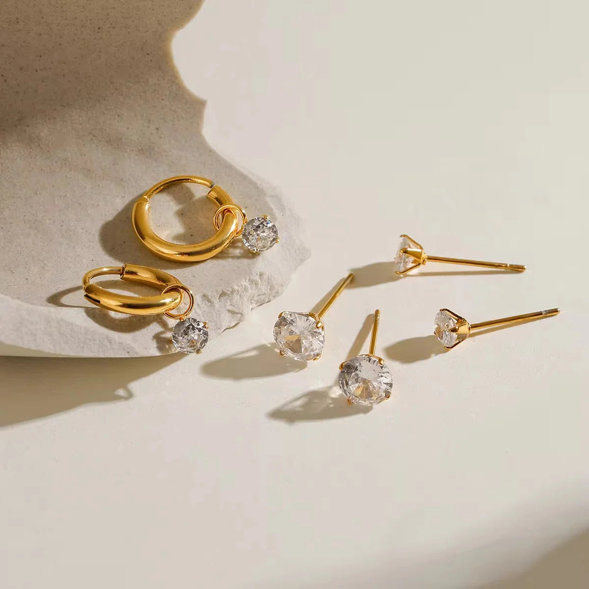Carys gold earring set with crystal drop hoops and crystal studs, view 2