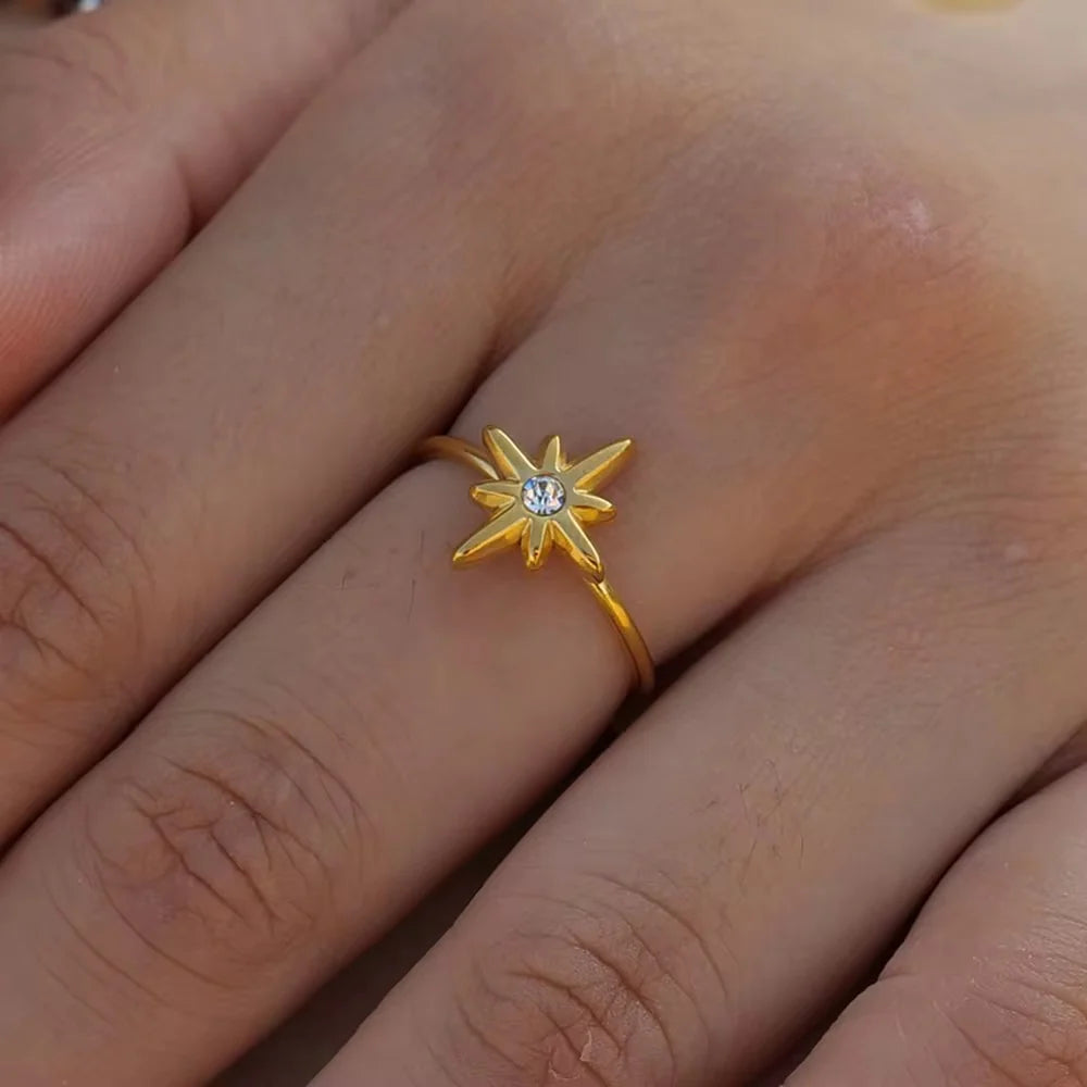 Seren slim gold open ring with a starburst and a clear stone, view 3