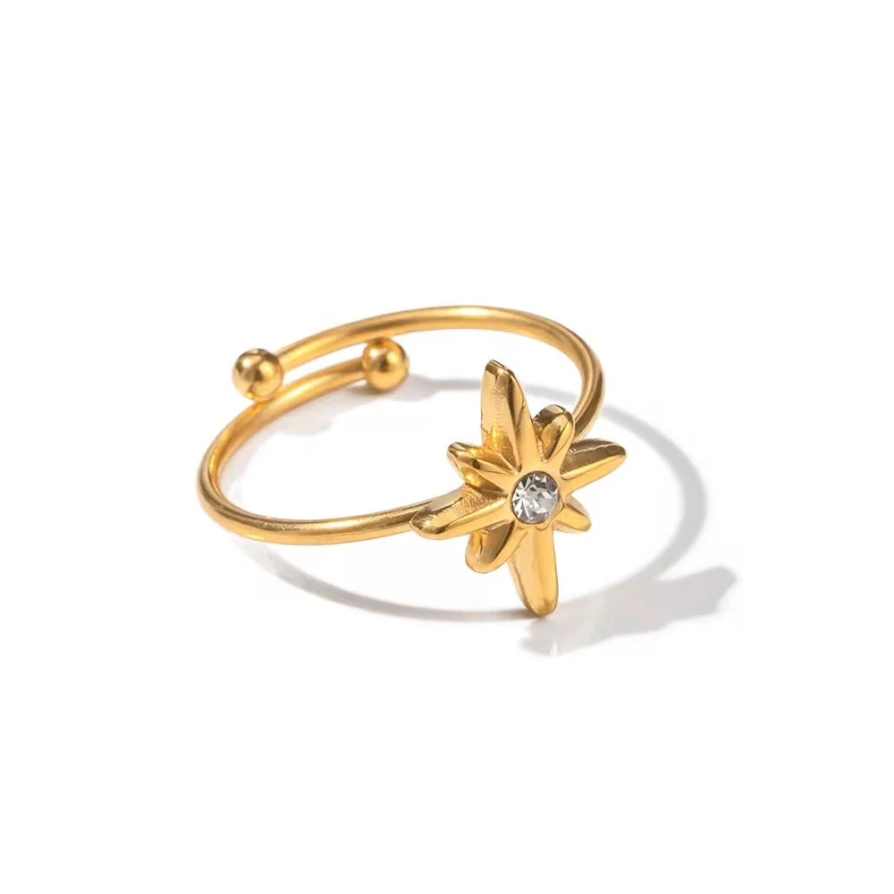 Seren slim gold open ring with a starburst and a clear stone, view 2