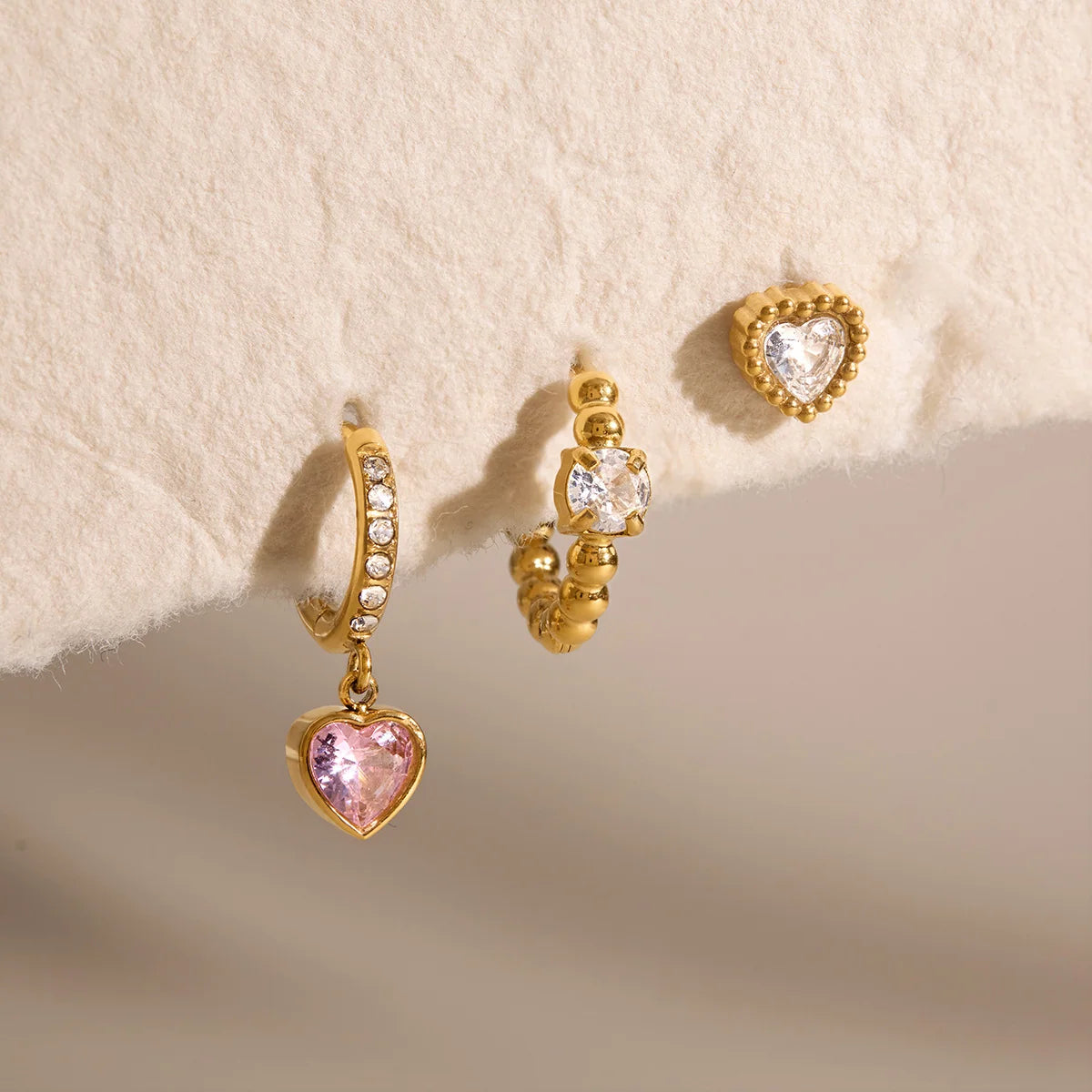 Delilah gold heart earring set with beaded hoop, pink heart drop huggie and heart stud, view 7