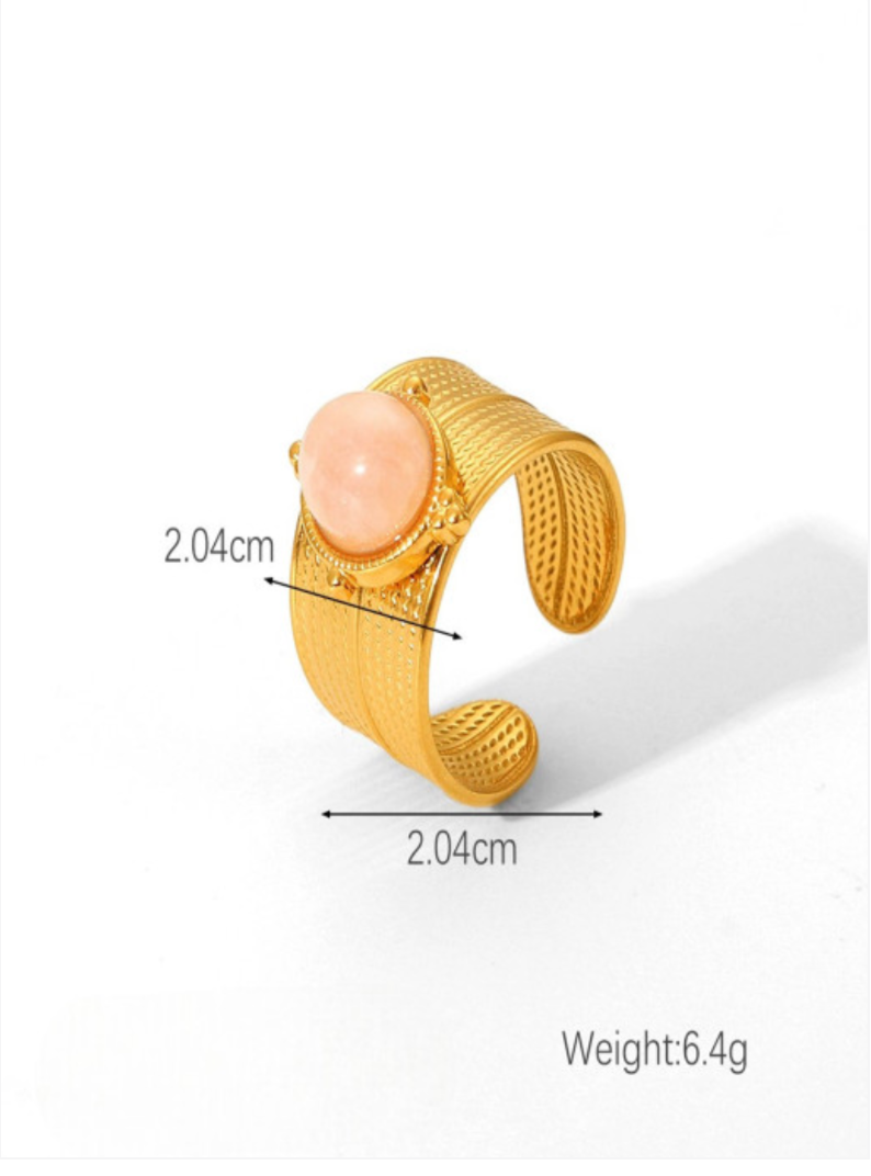 Daphne wide ribbed gold band ring with a pink oval stone, view 3