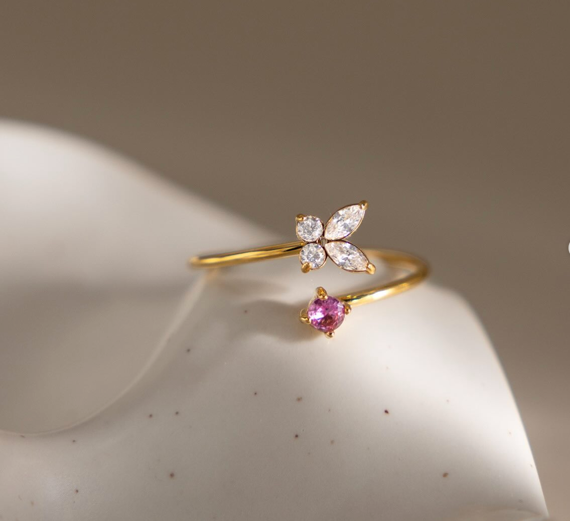 Mariposa gold open ring with a clear butterfly and a pink stone, view 3