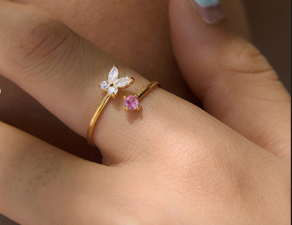 Mariposa gold open ring with a clear butterfly and a pink stone, view 4
