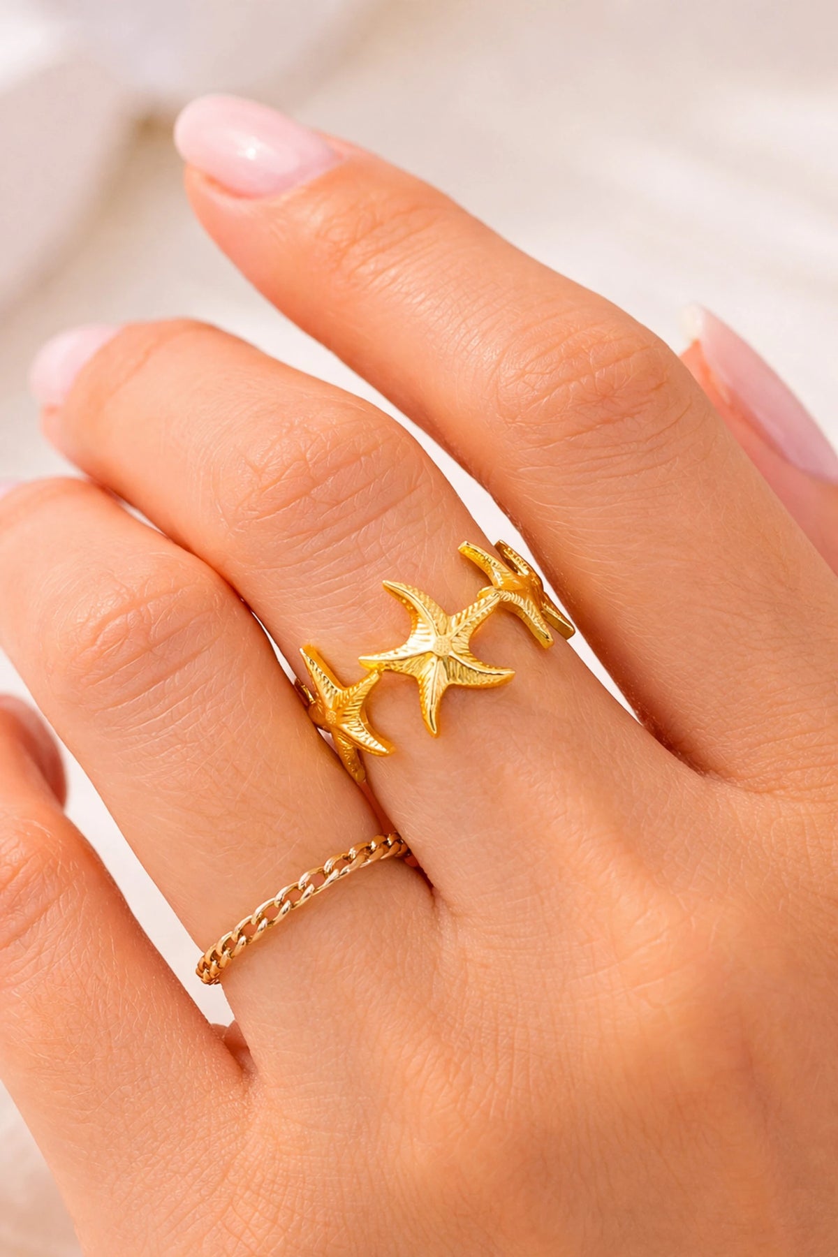 Nerissa gold ring with a cluster of textured starfish, view 3