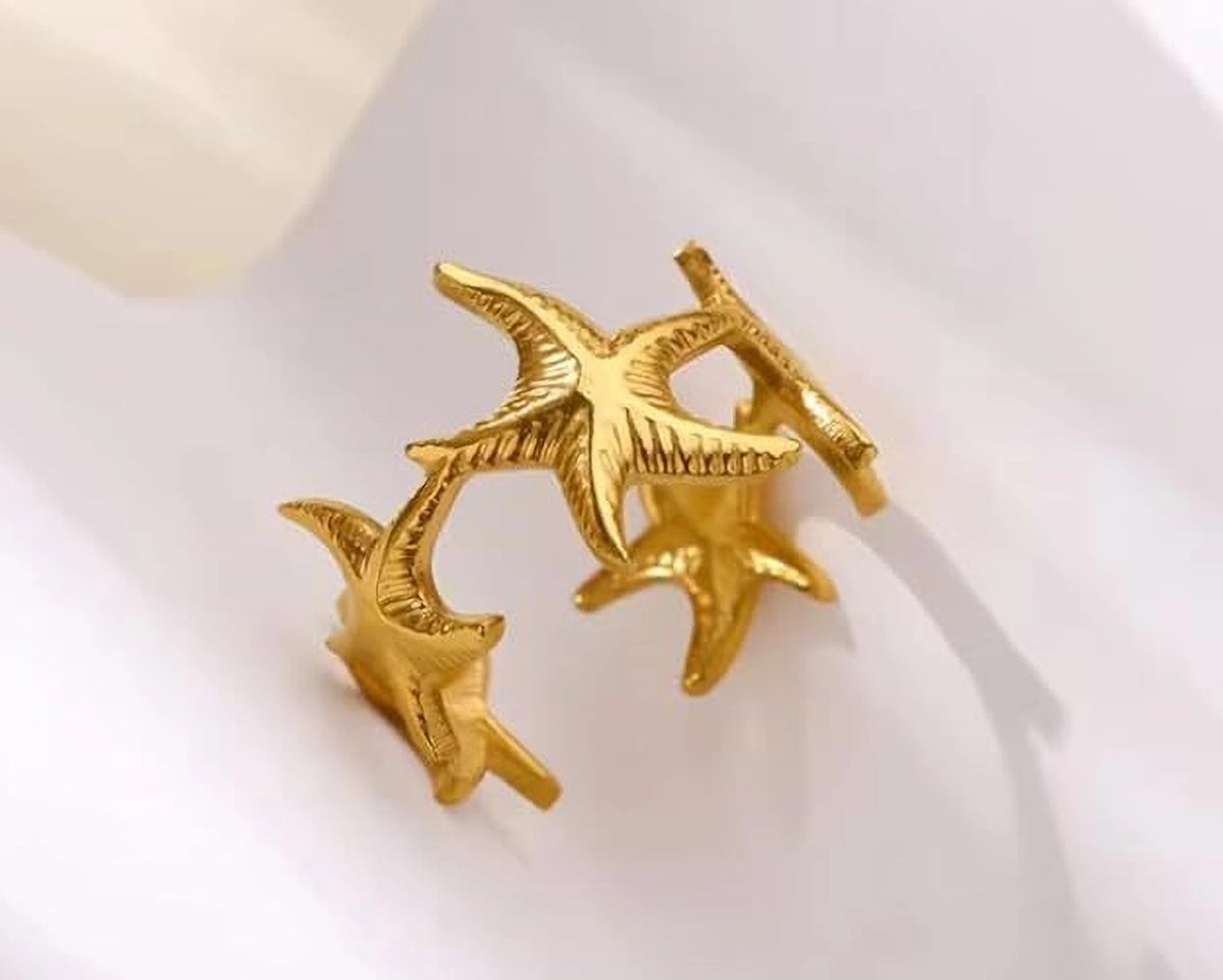 Nerissa gold ring with a cluster of textured starfish