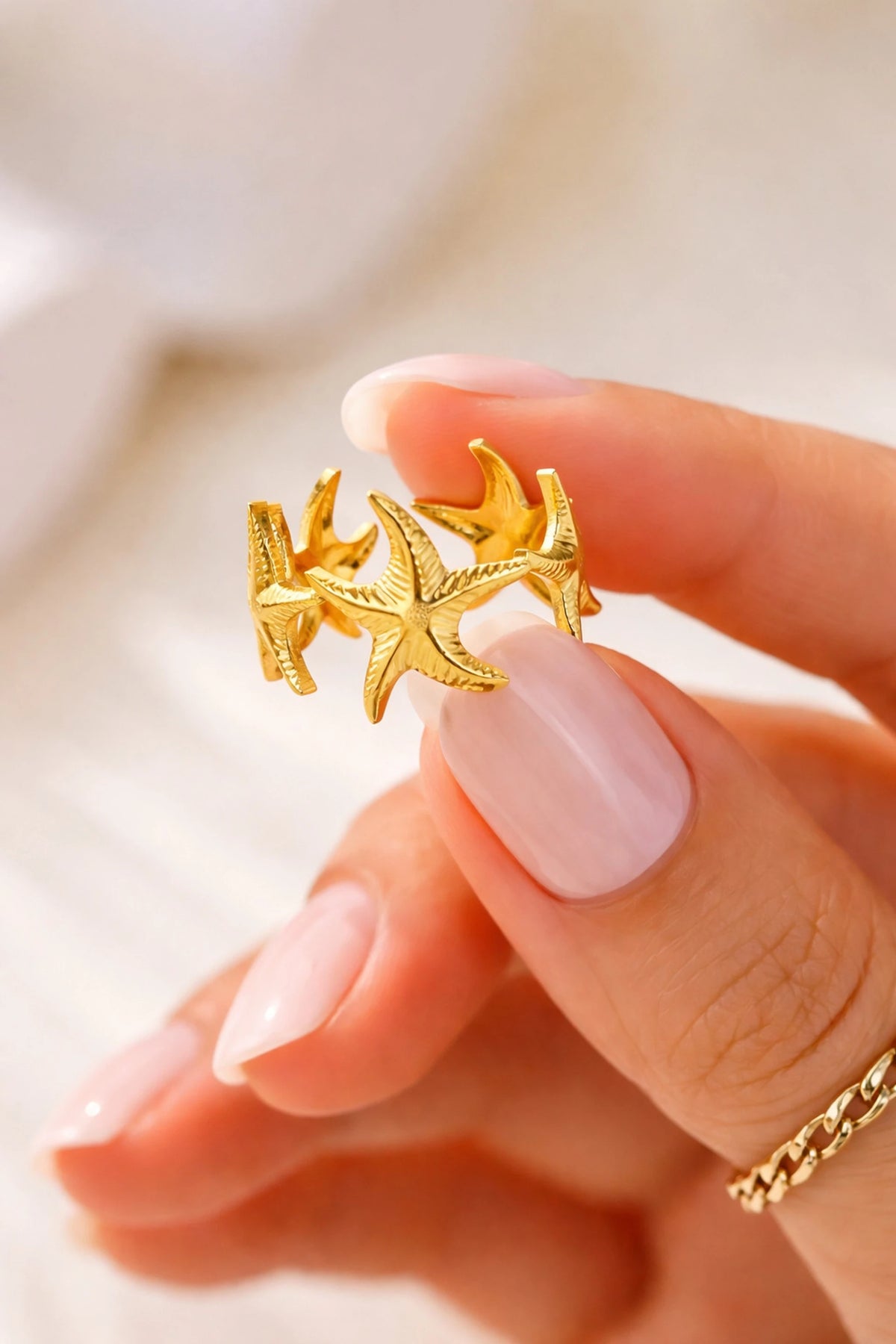 Nerissa gold ring with a cluster of textured starfish, view 2