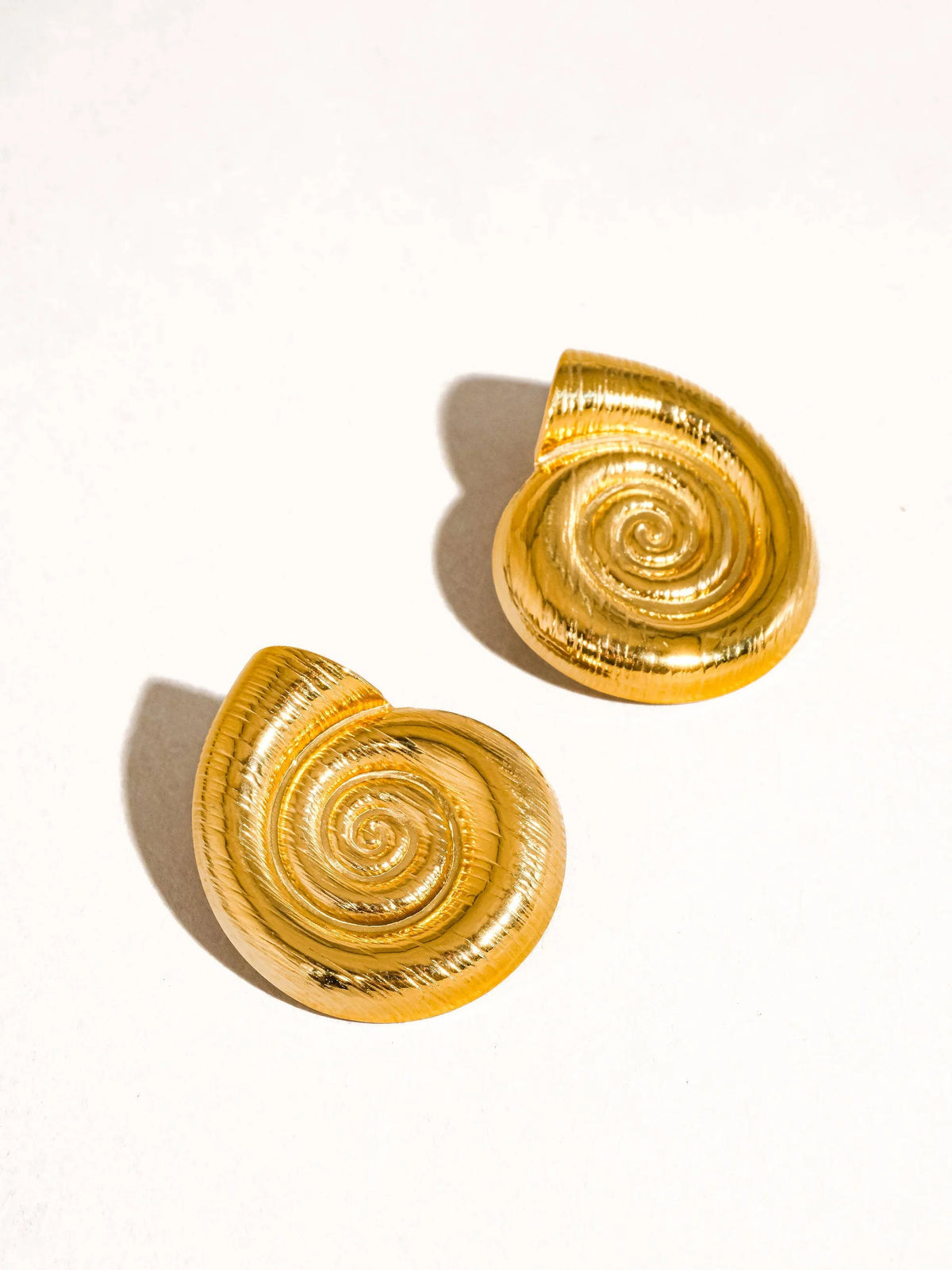 Celia gold spiral seashell stud earrings