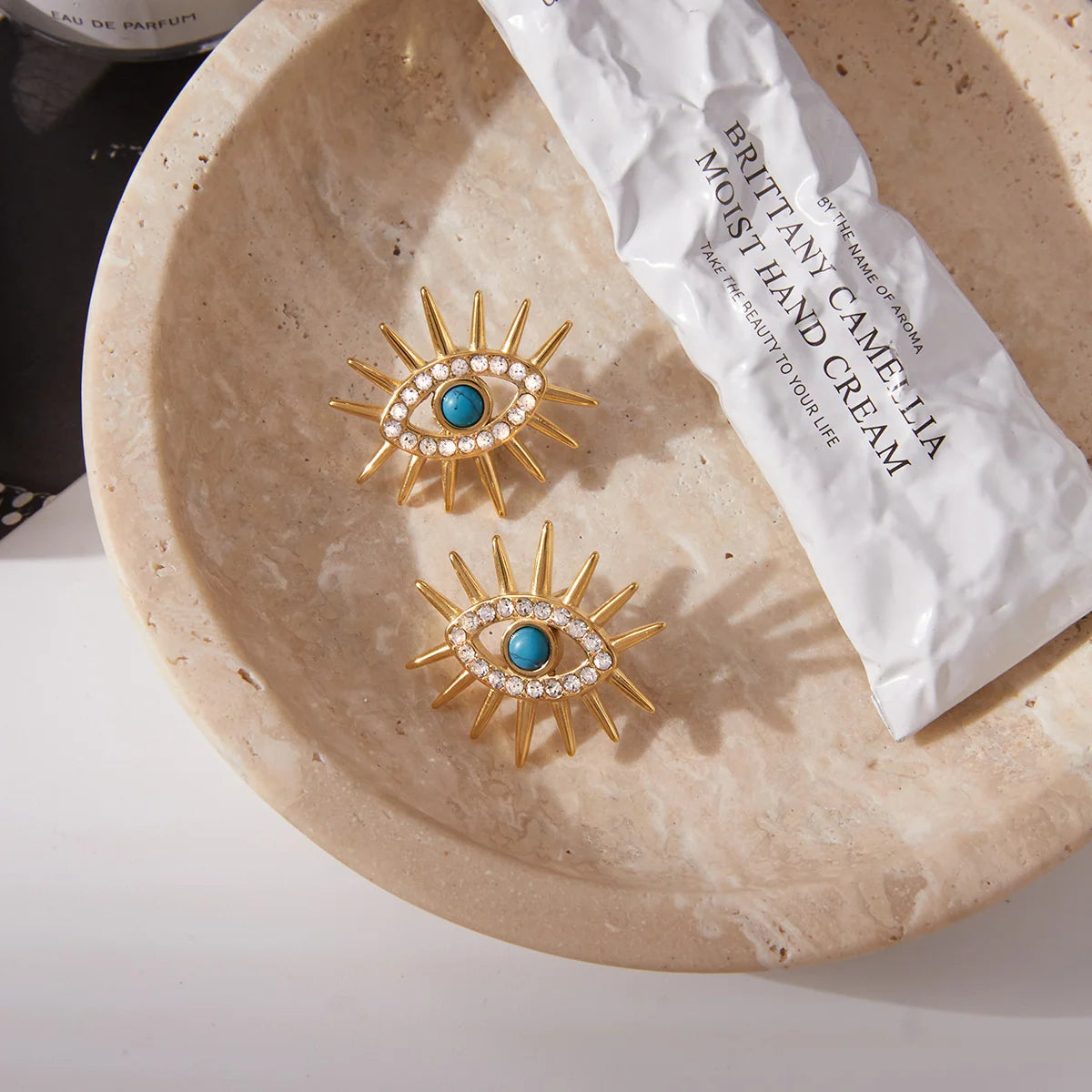 Yolanda gold sunburst stud earrings with turquoise evil eye and crystals, view 3