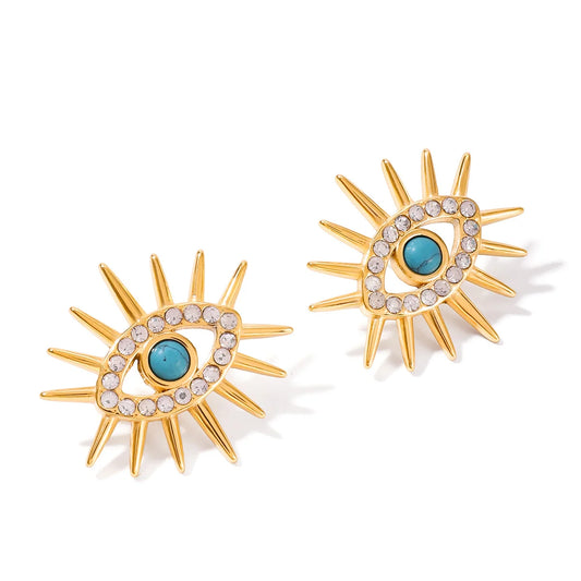 Yolanda gold sunburst stud earrings with turquoise evil eye and crystals