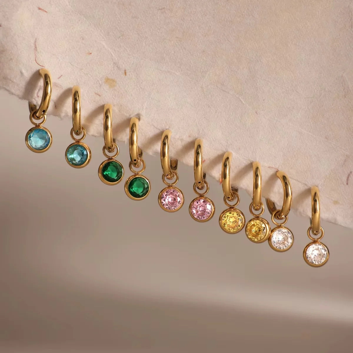 Callie gold hoop earrings with round bezel crystal charms in five colours