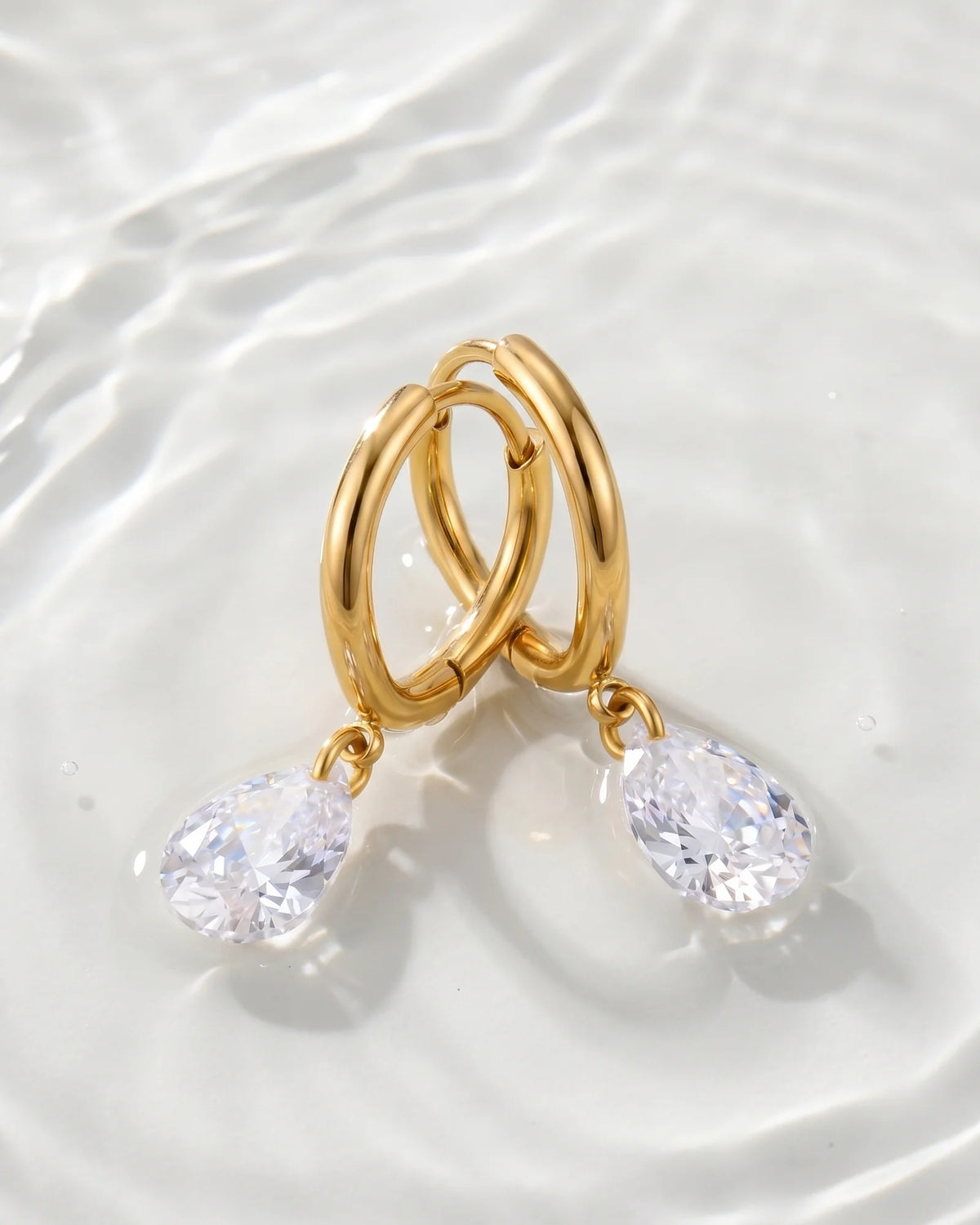 Lucy gold mini hoop earrings with pear crystal drop, view 8