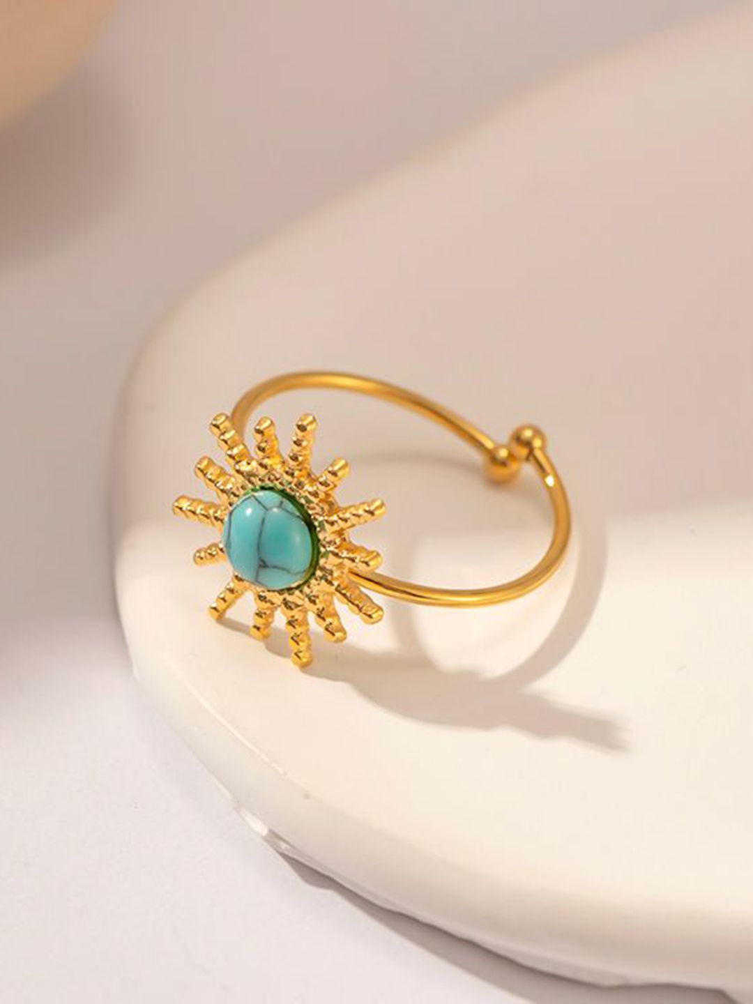 Soleil gold sun ring with a turquoise coloured stone